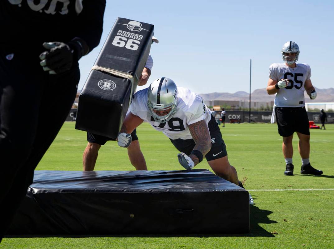 Raiders offensive lineman Jeremiah Poutasi participates in drills during training camp at Raide ...