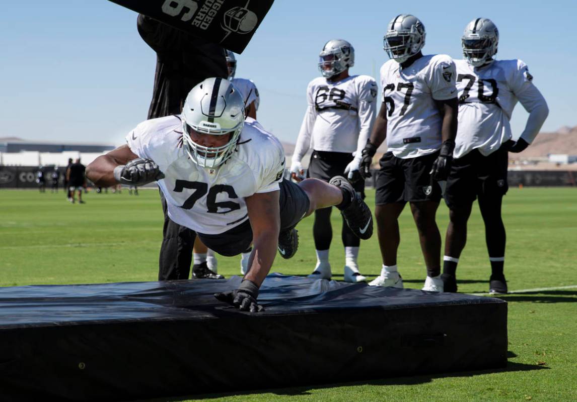 Raiders offensive guard John Simpson participates in drills during training camp at Raiders Hea ...