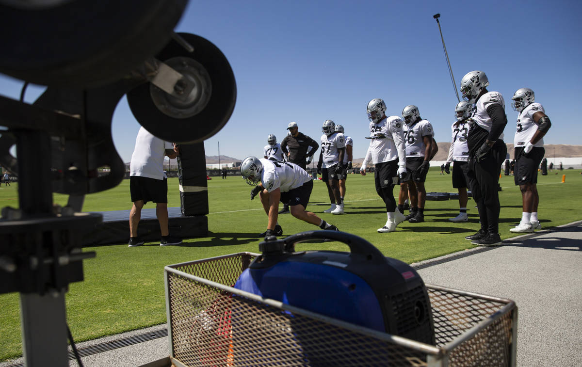 Raiders offensive linemen participate in drills during training camp at Raiders Headquarters/In ...