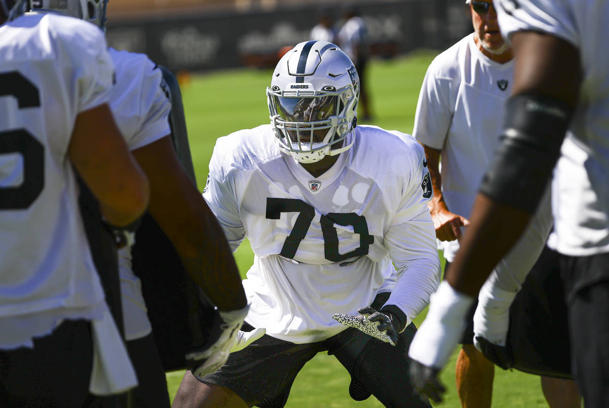 Raiders offensive tackle Alex Leatherwood participates in drills during training camp at Raider ...