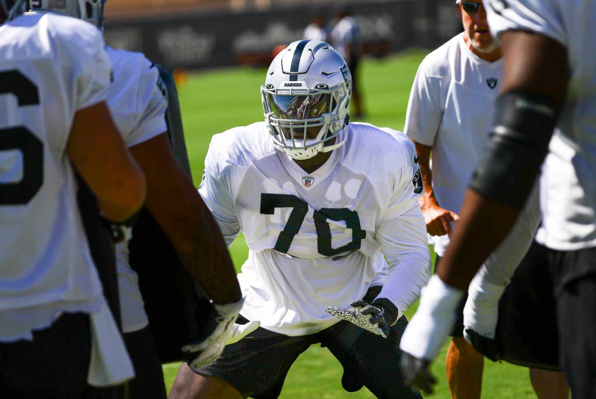 Raiders offensive tackle Alex Leatherwood participates in drills during training camp at Raider ...