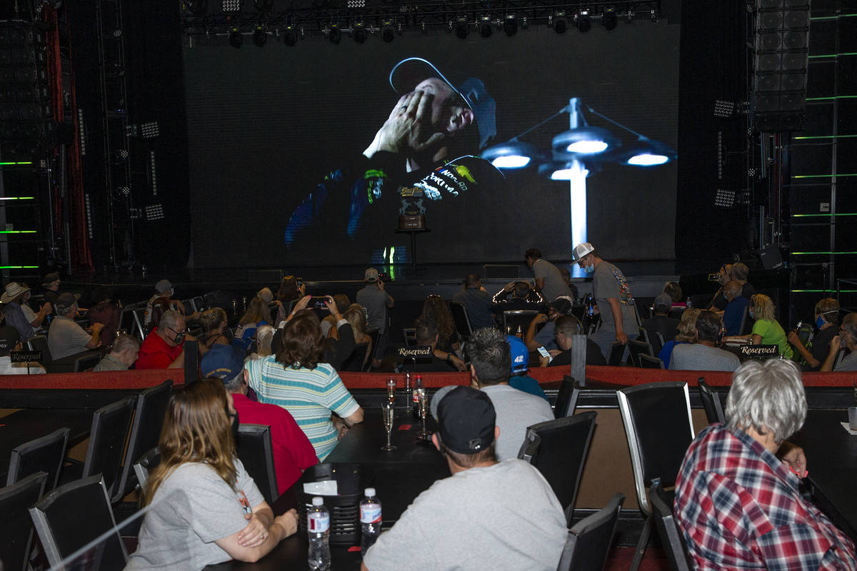 Fans watch footage of Kurt Busch, a NASCAR driver from Las Vegas, winning the 2020 South Point ...