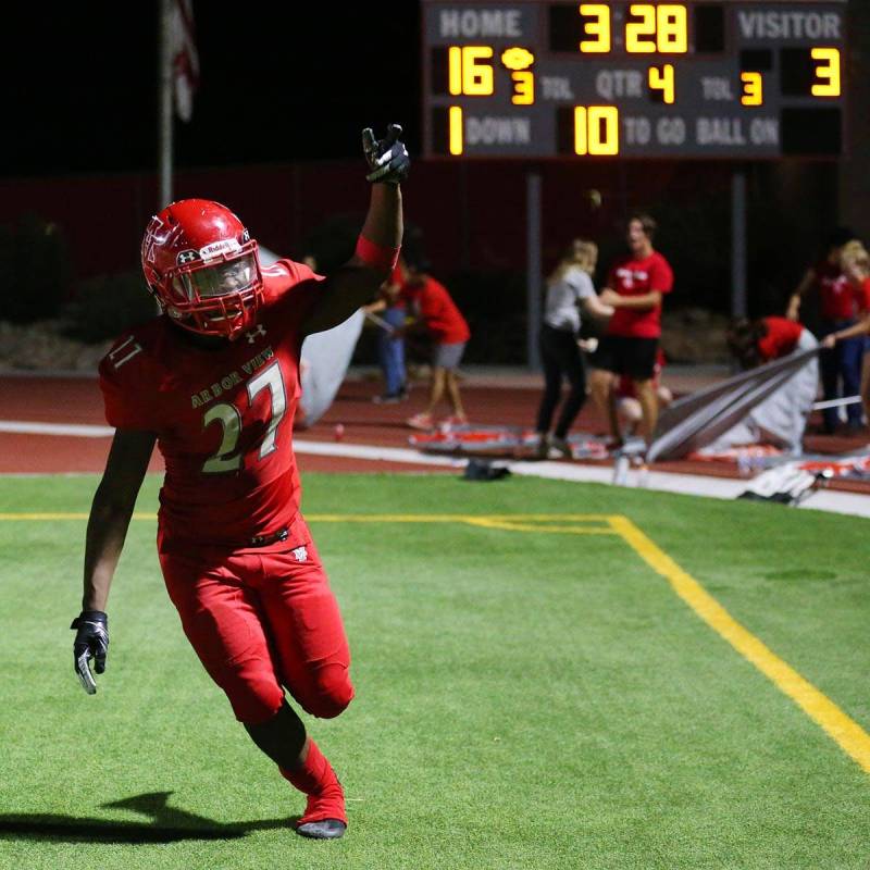 Arbor View's (27) celebrates a touchdown during the fourth quarter of a football game against F ...