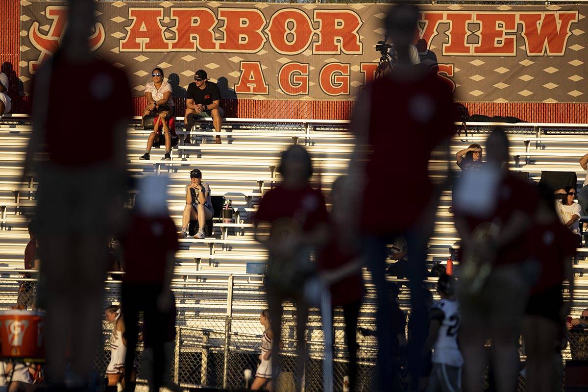 People attend a football game between Arbor View and Faith Lutheran at Arbor View High School i ...
