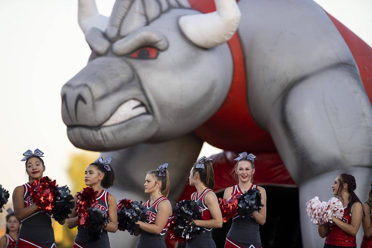 Cheerleaders get ready before the start of a football game between Arbor View and Faith Luthera ...