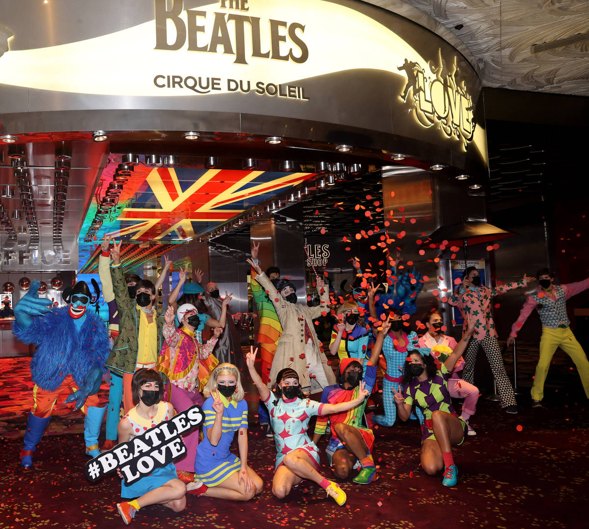 The cast of The Beatles LOVE entertain guests, employees, and fans during a celebratory pop-up ...