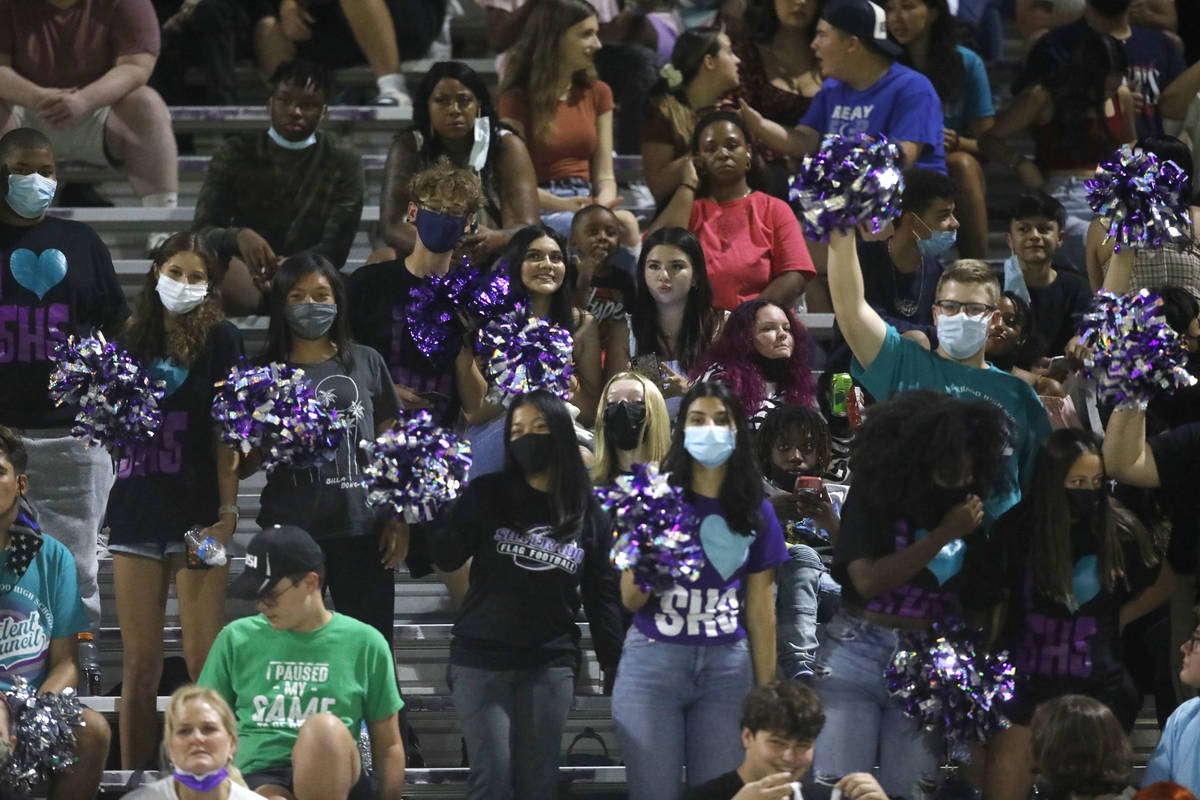 Silverado High School's fans cheer during the first half of a football game against Shadow Ridg ...