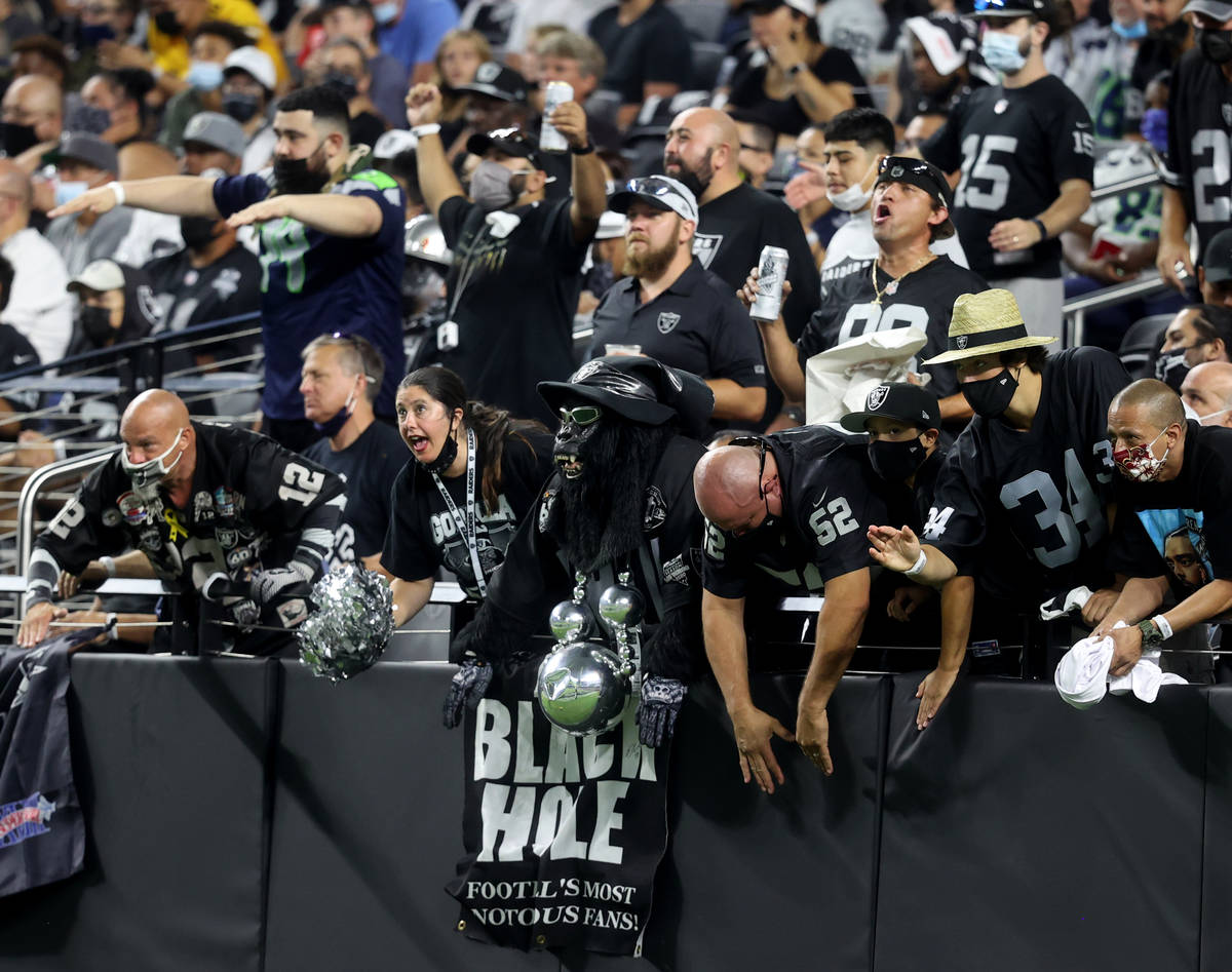 Fans in the Black Hole cheer during the third quarter of the Raiders home opening pre-season NF ...