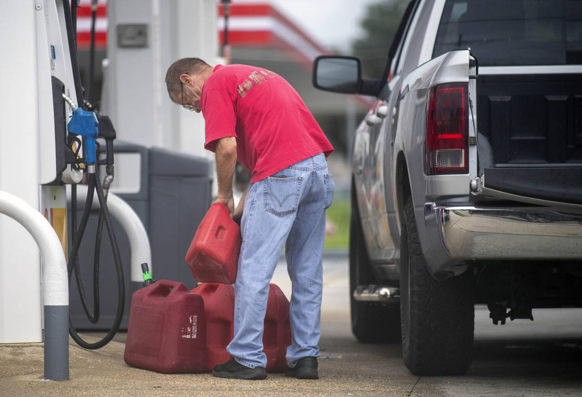 St. Bernard Parish residents fill up their cars and gas cans as the Louisiana coast prepares fo ...
