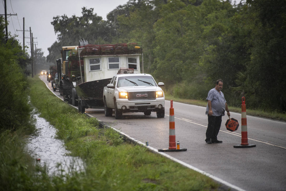 Boats and campers head out of the far eastern part of St. Bernard Parish as the Louisiana coast ...