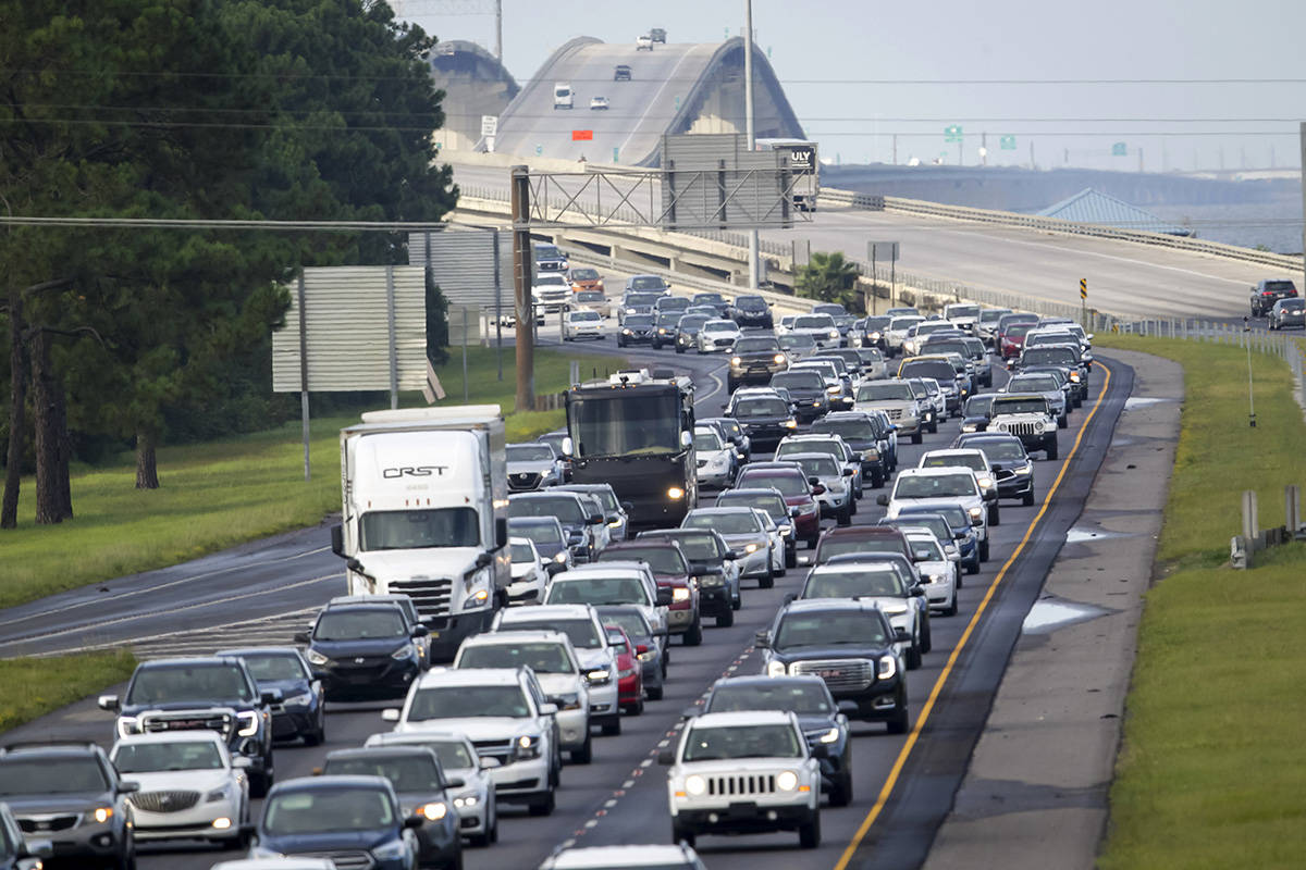 Interstate 10 near Slidell, La., is packed with evacuees heading east Saturday, Aug. 28, 2021, ...