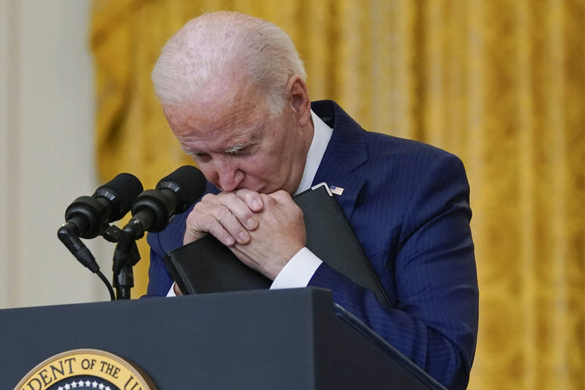 President Joe Biden pauses as he listens to a question about the bombings at the Kabul airport ...