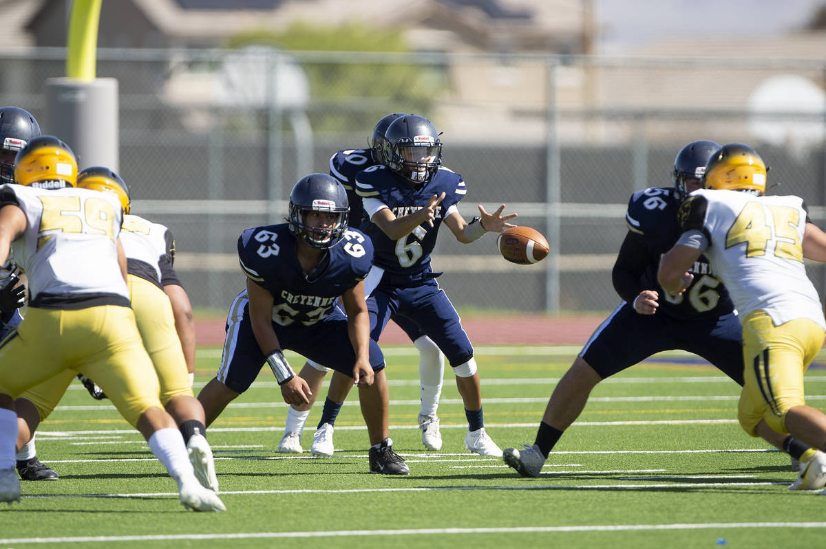 Cheyenne quarterback Kaleigha Plett (6) looks to catch the snap during a football game against ...