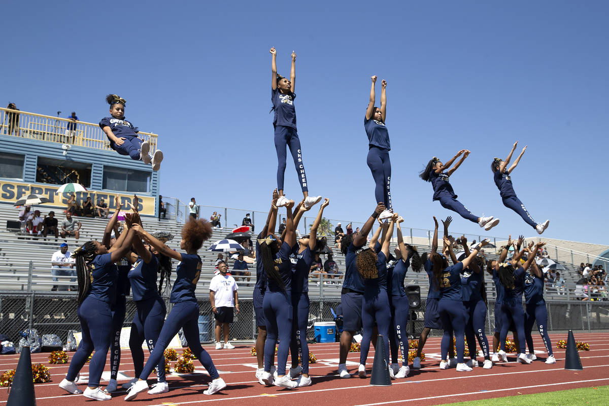 Cheyenne cheerleaders perform stunts during a football game against Clark High School at Cheyen ...