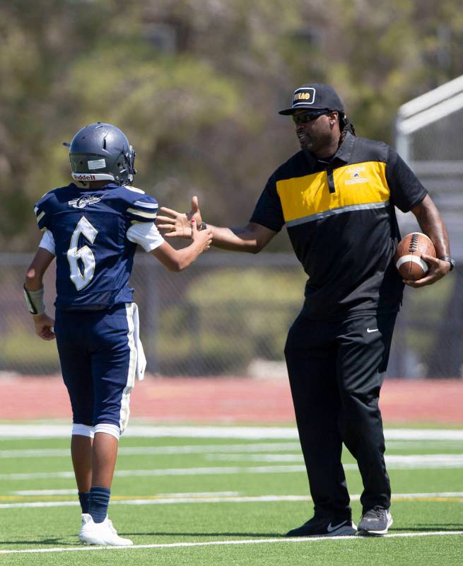 Clark head coach Deumaine Reeder goes in for a handshake with Cheyenne quarterback Kaleigha Ple ...