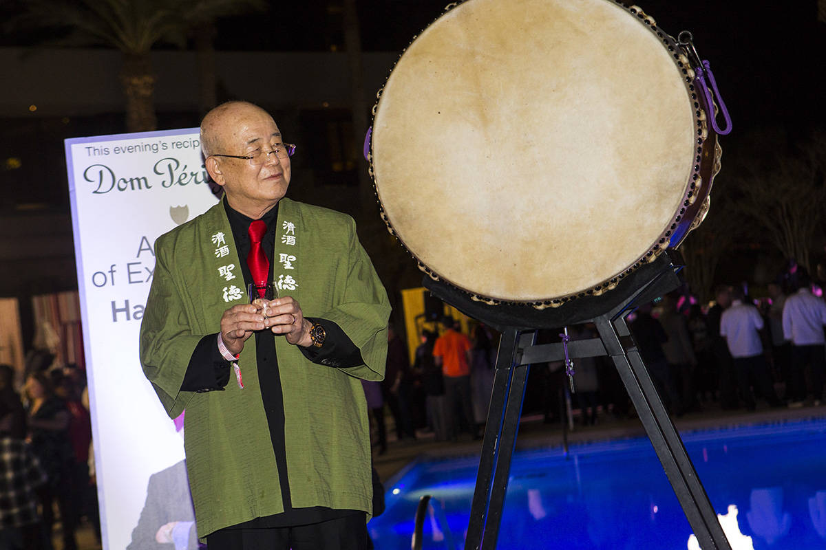 Honoree Hae Un Lee, a.k.a. Mr. Lee, looks on while participating in a sake barrel ceremony duri ...