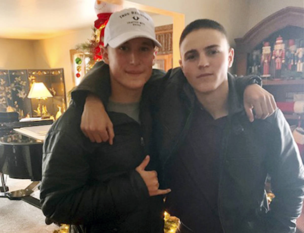 This Dec. 2019, photo provided by Regi Stone shows Eli Stone, left, and Rylee McCollum, at Chri ...