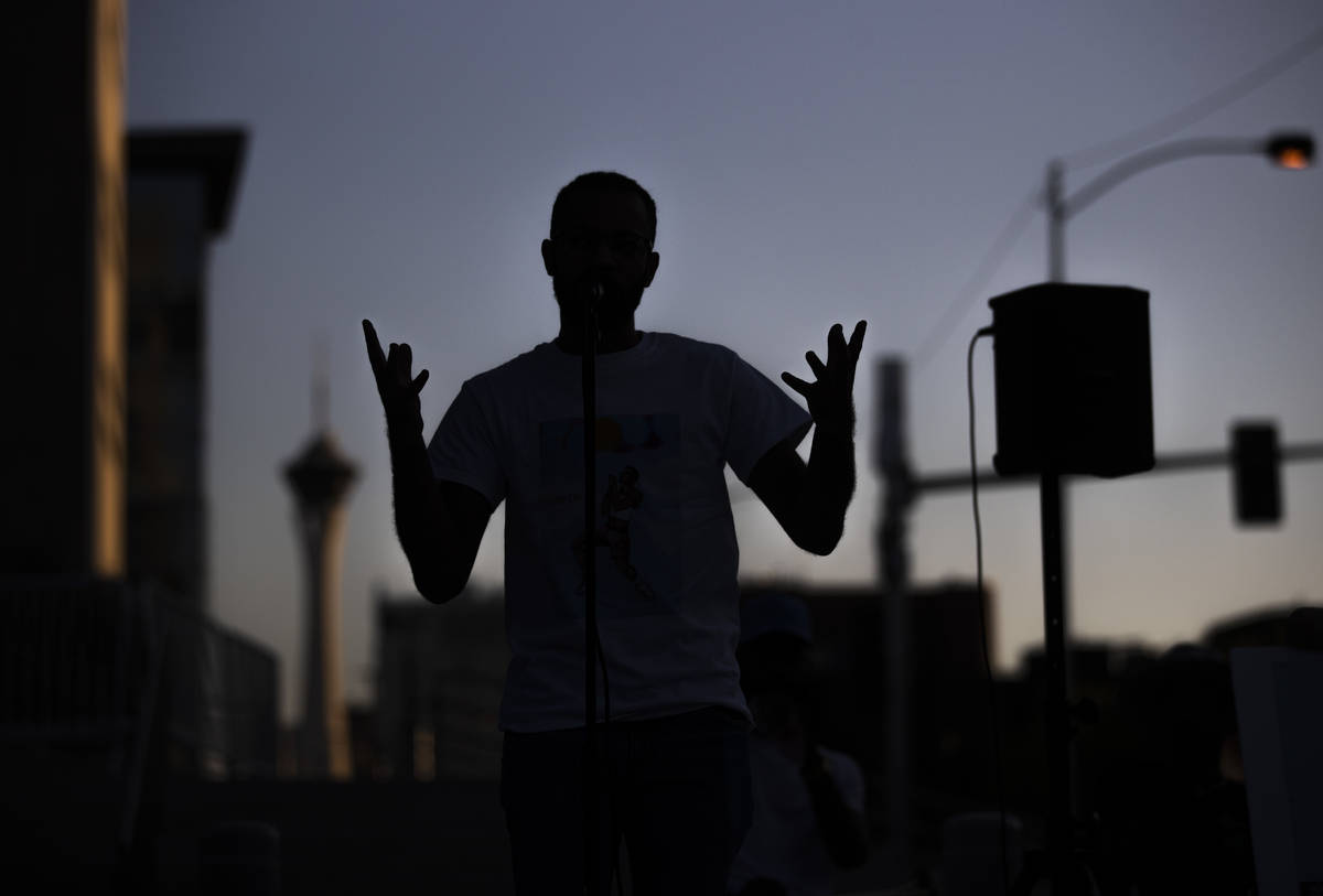 Loni Sterling performers a piece of poetry he wrote during an event against voter suppression s ...