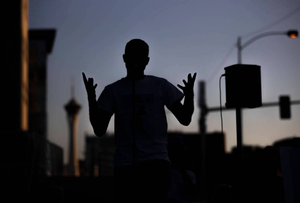 Loni Sterling performers a piece of poetry he wrote during an event against voter suppression s ...