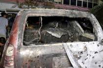 The broken door of a house is seen after U.S. drone strike in Kabul, Afghanistan, Sunday, Aug. ...