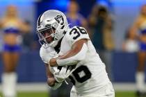 Las Vegas Raiders running back Trey Ragas runs for a touchdown during a preseason NFL football ...