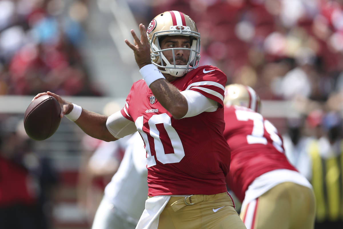 San Francisco 49ers quarterback Jimmy Garoppolo (10) looks to pass against the Las Vegas Raider ...