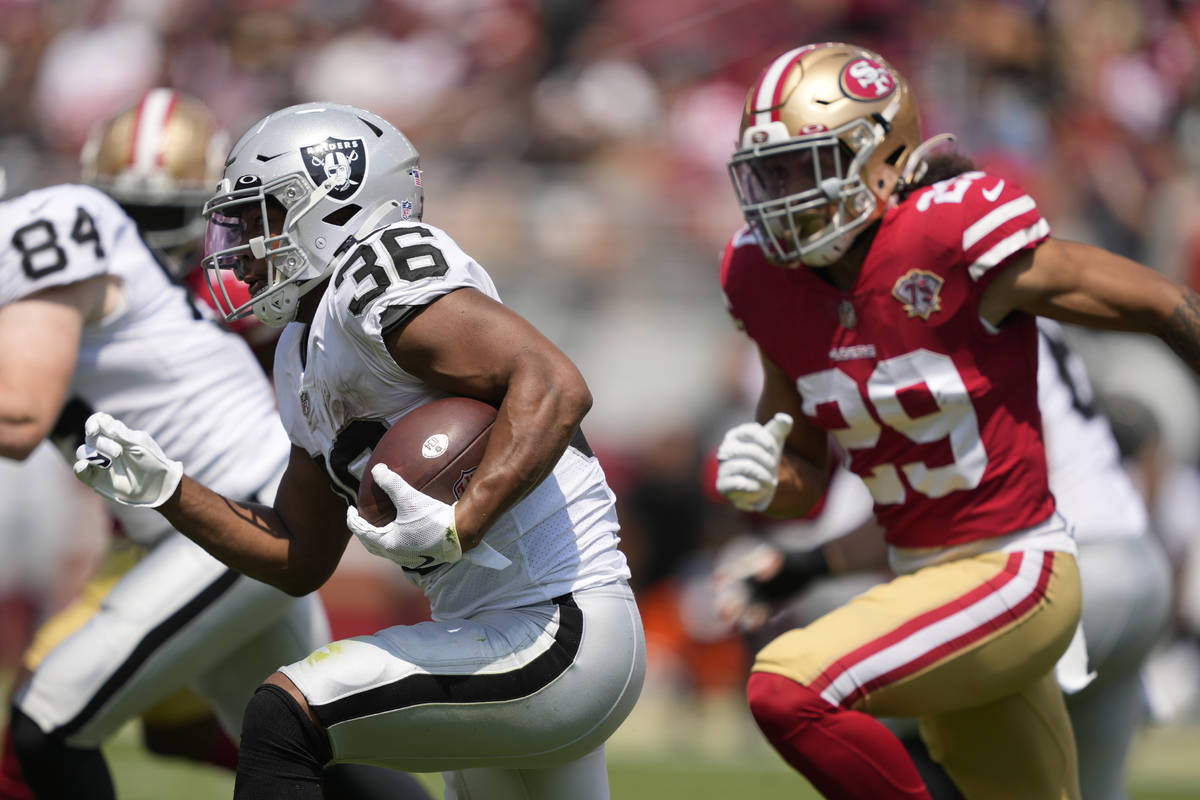 Las Vegas Raiders running back Trey Ragas (36) runs against San Francisco 49ers safety Talanoa ...