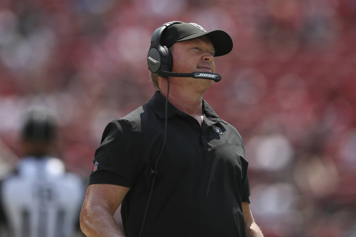 Las Vegas Raiders head coach Jon Gruden watches during the first half of an NFL preseason footb ...
