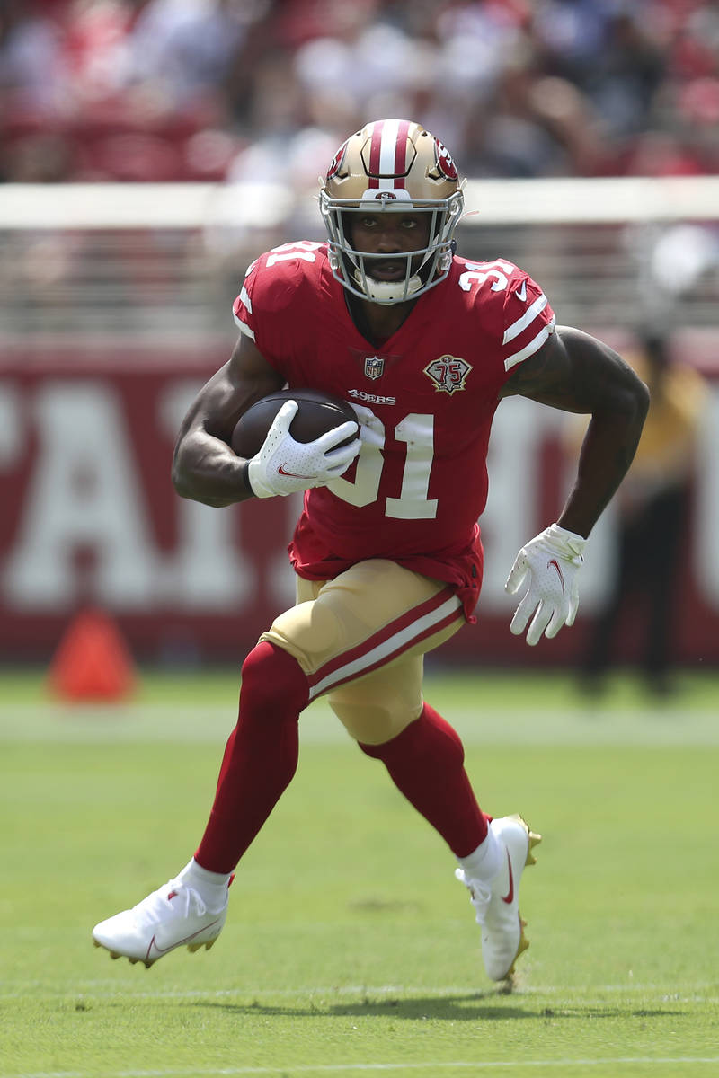 San Francisco 49ers running back Raheem Mostert (31) runs against the Las Vegas Raiders during ...