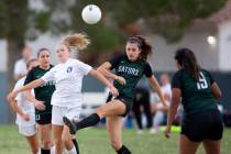 Green Valley's Chase Northam (14) attempts to pass while Foothill's Emma Rietz (9) falls behind ...