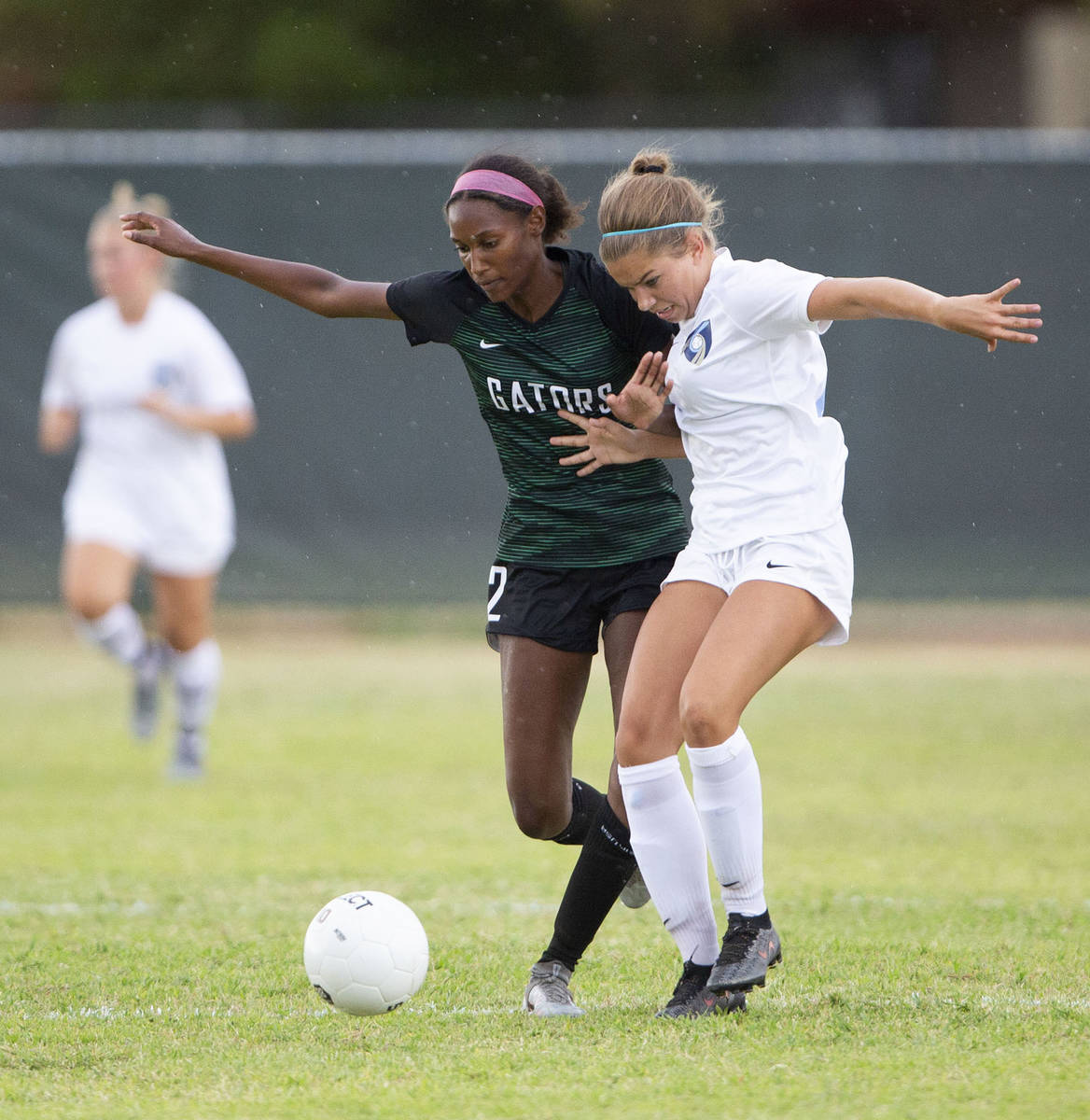 Green Valley's Sage Reed (2) and Foothill's Isabelle Simoneau (16) compete for the ball during ...