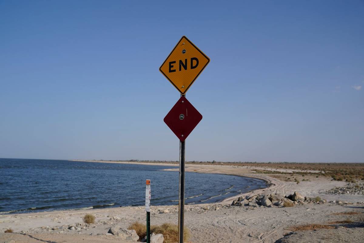 A sign is posted at the end of a road leading to the Salton Sea in Desert Shores, Calif., Wedne ...
