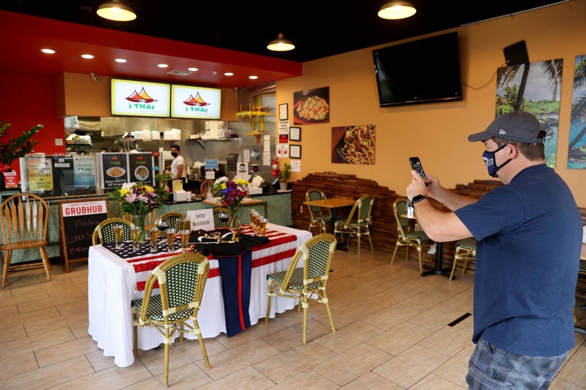Jay Babineau of Las Vegas takes a photo of a display at i Thai Kitchen on Craig Road near Jones ...