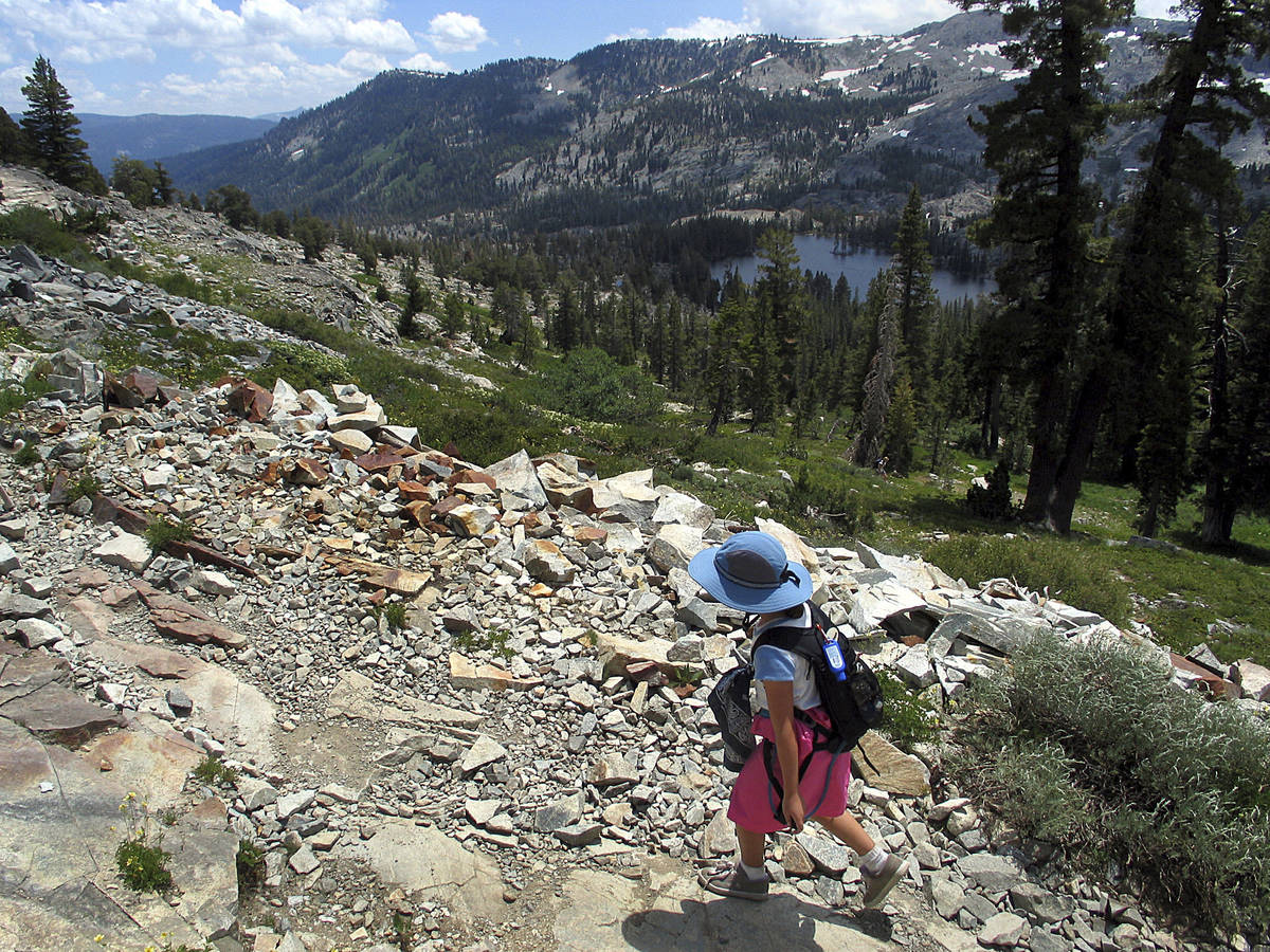 In this July 20, 2005 file photo, a lone hiker scales a rocky path into Desolation Wilderness, ...