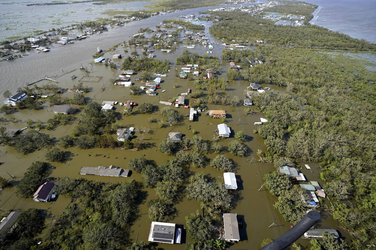 Homes are flooded in the aftermath of Hurricane Ida, Monday, Aug. 30, 2021, in Lafitte, La. The ...