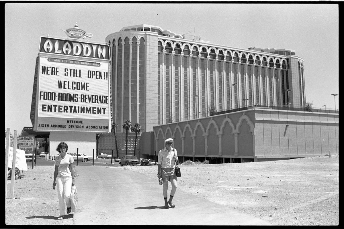 The exterior of the Aladdin Hotel and casino in July 1980 with a sign that says "We're Still Op ...