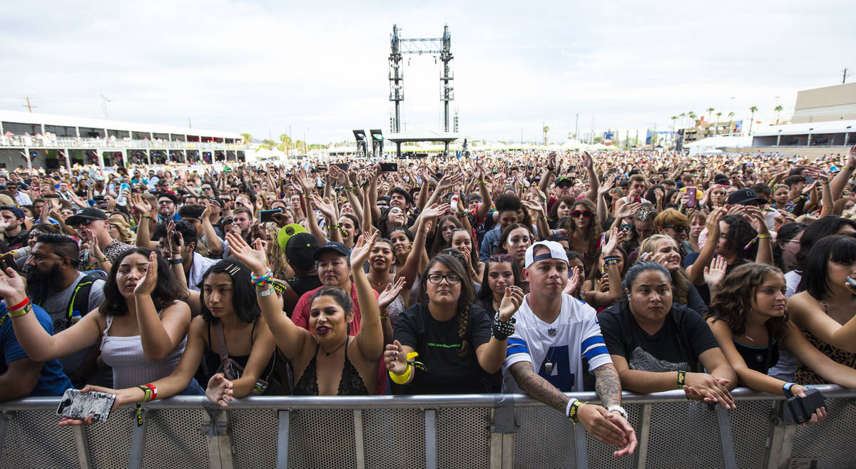 Fans react as Lewis Capaldi, not pictured, performs at the downtown stage during day 3 of the L ...