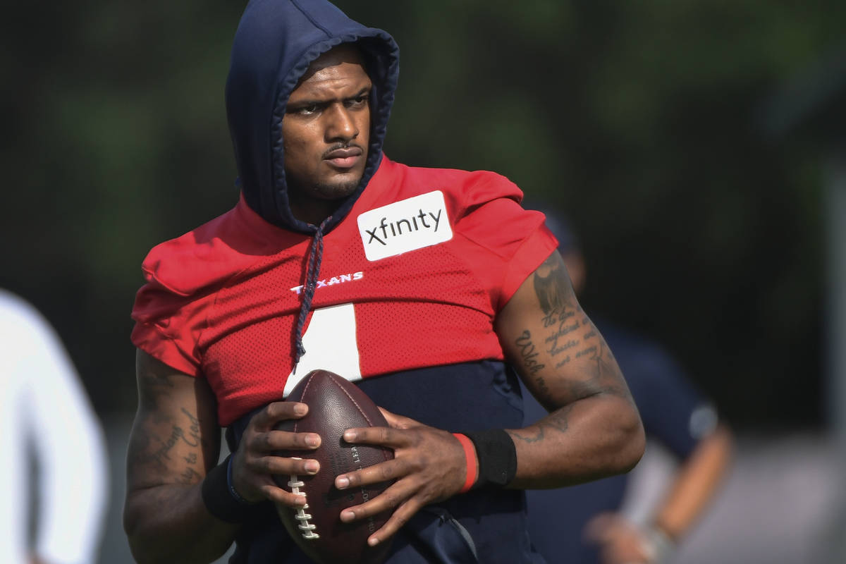 FILE- In an Aug. 2, 2021 file photo, Texans quarterback Deshaun Watson practices with the team ...