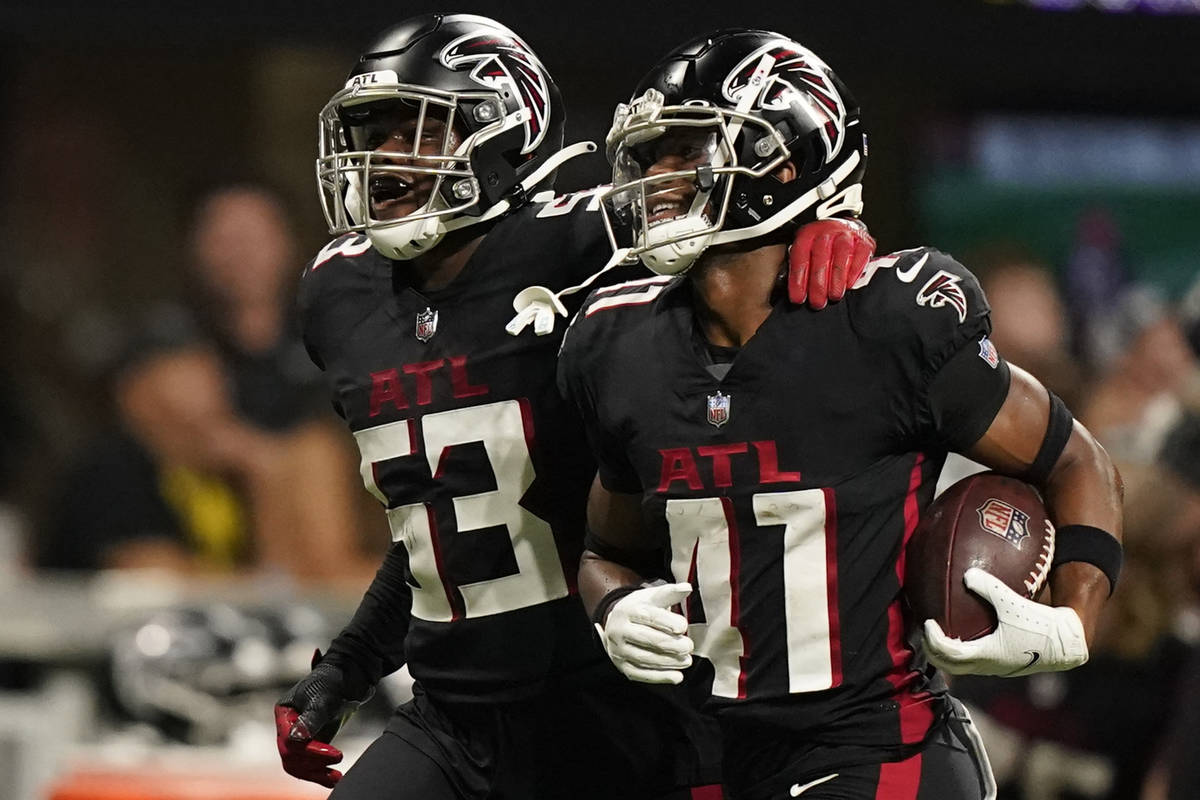 Atlanta Falcons long snapper Josh Harris (47) celebrates with Atlanta Falcons linebacker Erroll ...