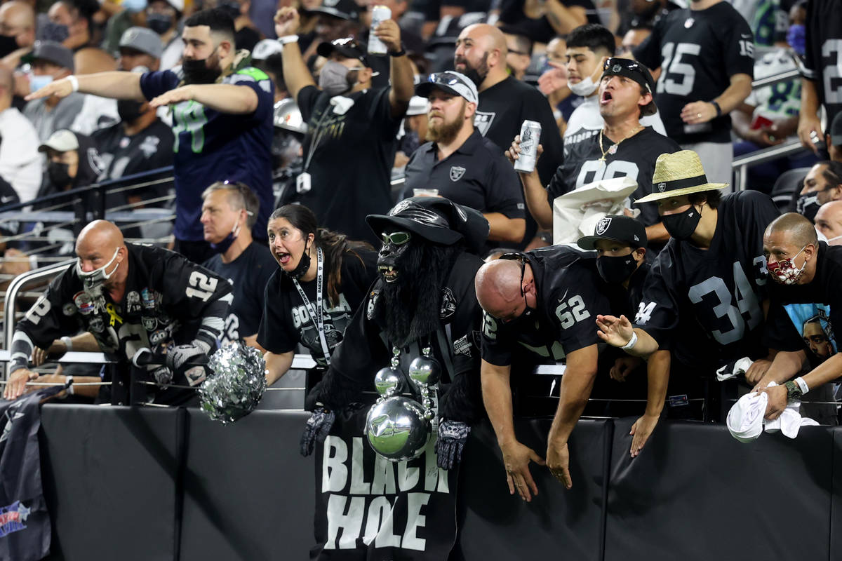 Fans in the Black Hole cheer during the third quarter of the Raiders home opening pre-season NF ...