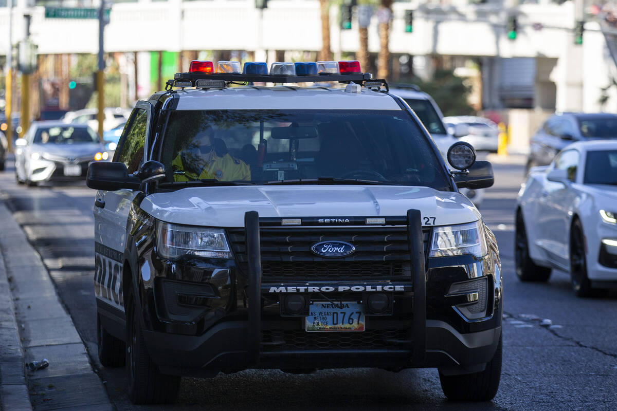 A Metropolitan police officer responds to a welfare check outside the Fountains of Bellagio on ...
