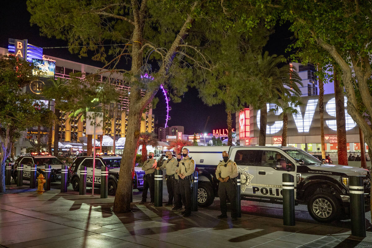 Las Vegas Metro Police are seen patrolling near the Bellagio hotel and casino fountains on the ...