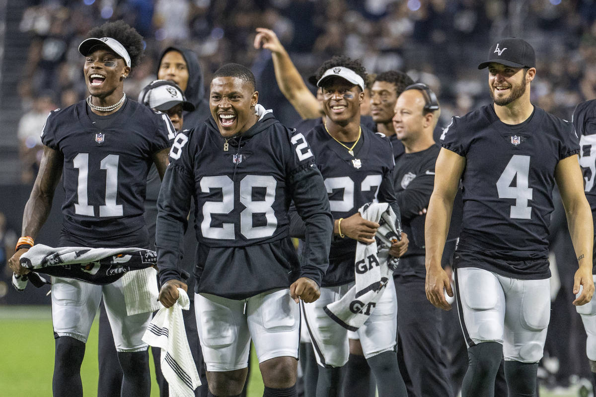 (From left) Raiders wide receiver Henry Ruggs III (11), running back Josh Jacobs (28), running ...
