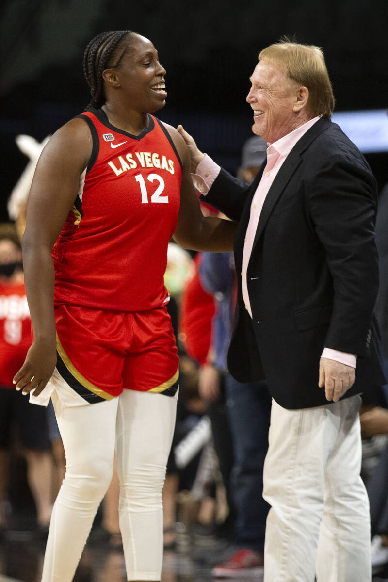 Las Vegas Aces guard Chelsea Gray (12) and Las Vegas Raiders owner Mark Davis share a moment af ...