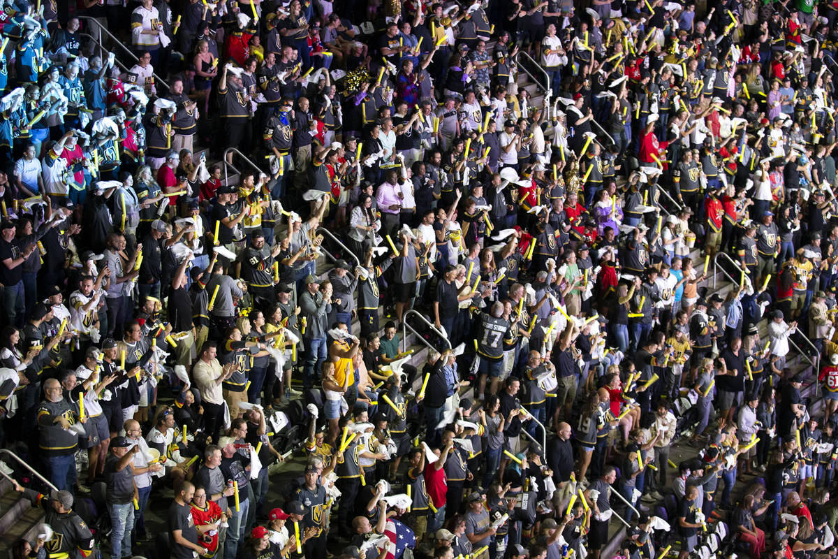 The crowd goes wild after Golden Knights defenseman Shea Theodore (27) scored the first goal ag ...