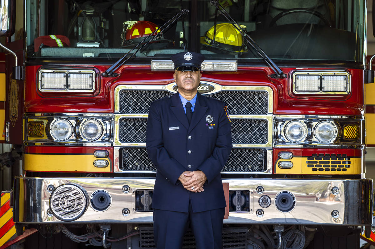 Retired New York firefighter Frank Pizarro stands before a firetruck at Las Vegas Fire and Res ...