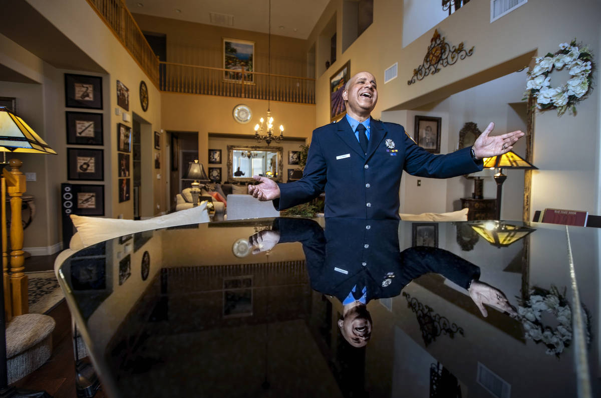 Retired New York firefighter Frank Pizarro rehearses songs at his home on Friday, Aug. 27, 2021 ...