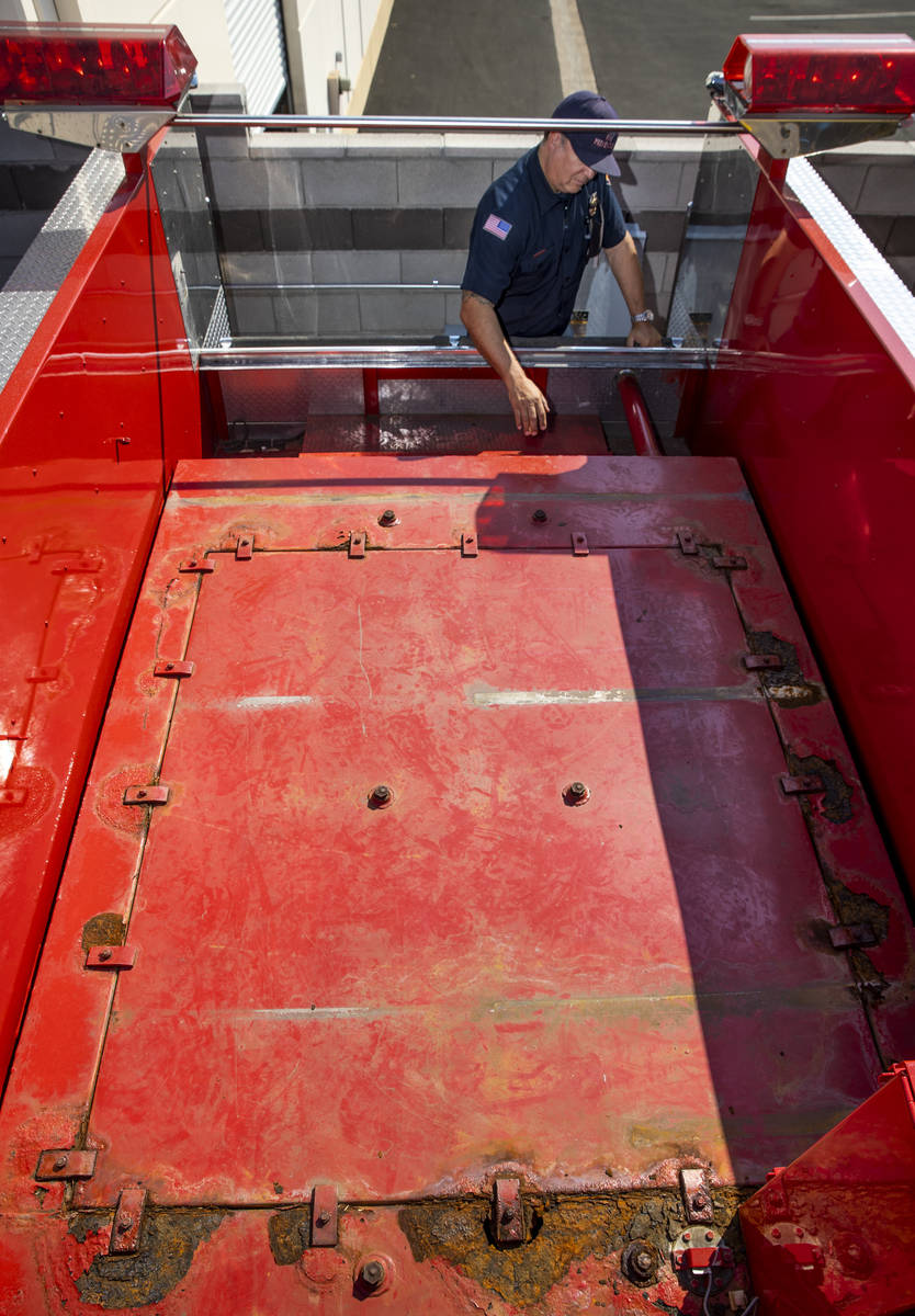 Nick Giolito examines the bed of a 1991 Pierce firetruck which is undergoing restoration at Fi ...
