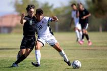 Palo Verde's Elad Cohen (8) competes for the ball with Liberty's Carmelo Gullotta (18) during t ...
