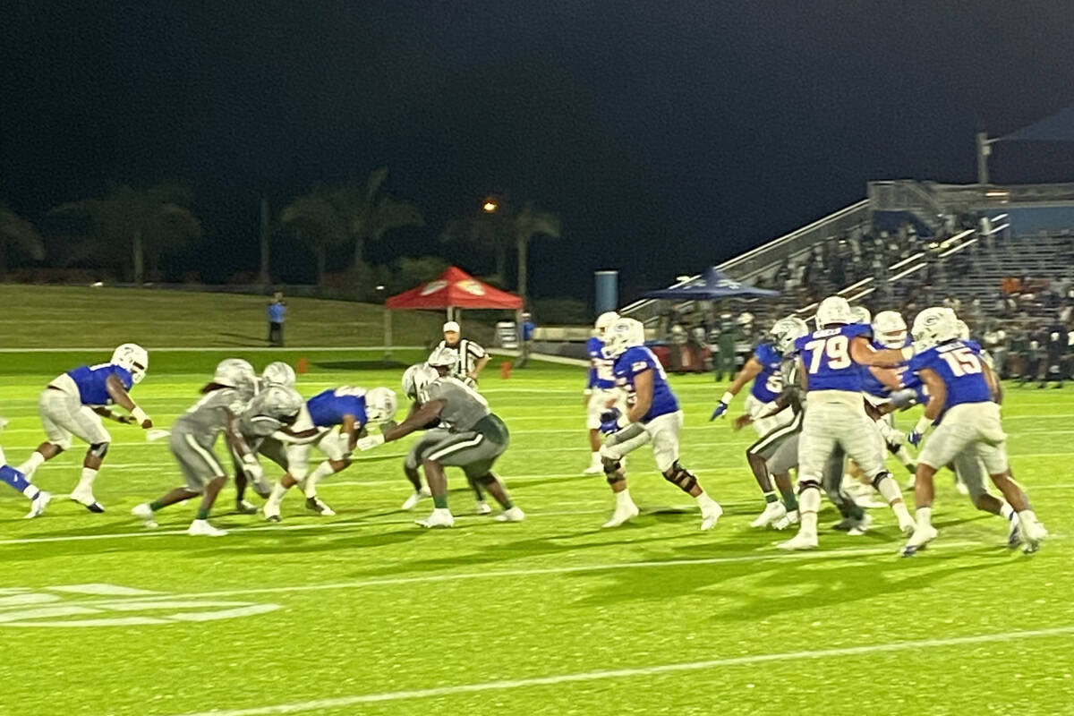 Bishop Gorman running back Cam Barfield churns for extra yardage in Bishop Gorman's 21-20 win o ...
